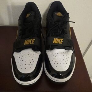 Nike Black and White Sneakers with Gold Accents